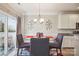 Bright dining area with sliding doors and views to the outdoor area at 558 Rough Hewn Ln, Rock Hill, SC 29730