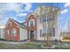Lovely two-story home with brick and vinyl siding, landscaped yard and inviting entrance at 558 Rough Hewn Ln, Rock Hill, SC 29730