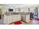 Kitchen featuring granite countertops, stainless steel appliances, and open layout to living area at 558 Rough Hewn Ln, Rock Hill, SC 29730