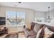 Living room featuring a cozy couch with accent pillows, a flat screen TV, and a window that allows ample natural light at 558 Rough Hewn Ln, Rock Hill, SC 29730