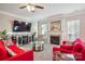 Cozy living room featuring a fireplace, plush seating, and entertainment center at 558 Rough Hewn Ln, Rock Hill, SC 29730