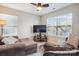 Living room area featuring a flat screen TV and lots of natural light coming in from a window with blinds at 558 Rough Hewn Ln, Rock Hill, SC 29730