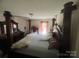 The main bedroom features a large window, offering natural light at 607 Anthony Grove Rd, Crouse, NC 28033