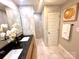 Tasteful bathroom featuring a dual sink vanity, quartz countertops, and a walk-in shower at 719 Washington St, Cramerton, NC 28032