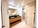Modern bathroom featuring a dual sink vanity, quartz countertops, and a walk-in shower at 719 Washington St, Cramerton, NC 28032