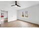 Spacious bedroom featuring hardwood floors, a ceiling fan, and bright, natural light at 719 Washington St, Cramerton, NC 28032