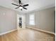 Comfortable bedroom featuring luxury vinyl plank flooring with an attached laundry room at 719 Washington St, Cramerton, NC 28032