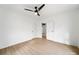 Open bedroom with hardwood floors, a ceiling fan, and bright, natural light at 719 Washington St, Cramerton, NC 28032
