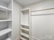 Walk-in closet with custom shelving for easy storage at 719 Washington St, Cramerton, NC 28032