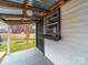 Charming covered entranceway with gray painted floor and flower box, perfect for welcoming guests at 719 Washington St, Cramerton, NC 28032