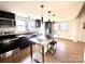 Contemporary kitchen with black cabinets, granite counters and island with seating at 719 Washington St, Cramerton, NC 28032