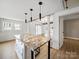 Open floor plan kitchen with large center island, granite countertop and barstool seating at 719 Washington St, Cramerton, NC 28032