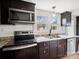 Modern kitchen features stainless appliances, granite counters, and ample cabinet space at 719 Washington St, Cramerton, NC 28032