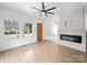 Bright living room featuring luxury vinyl plank flooring, fireplace, and lots of natural light at 719 Washington St, Cramerton, NC 28032