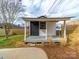 Exterior view of the shed with covered porch and landscaping at 719 Washington St, Cramerton, NC 28032