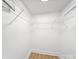 Bright walk-in closet with wire shelving and hardwood floors at 719 Washington St, Cramerton, NC 28032