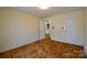 Bedroom showing access to kitchen and a second door at 7311 Dogwood Ln, Kannapolis, NC 28081