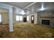 Spacious living room features a large window and brick fireplace at 7311 Dogwood Ln, Kannapolis, NC 28081