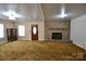 Inviting living room features a brick fireplace and wood mantle at 7311 Dogwood Ln, Kannapolis, NC 28081