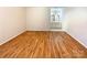 Bedroom with wood floor and bathroom with white cabinets in the background at 807 Limerick Dr, Dallas, NC 28034