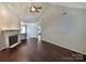 Bright, open living room with a vaulted ceiling, fireplace, and hardwood floors at 807 Limerick Dr, Dallas, NC 28034