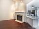 Cozy living room showcasing a fireplace, hardwood floors, and an open concept design at 807 Limerick Dr, Dallas, NC 28034