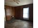Bedroom featuring wood-paneled walls and a ceiling fan for added comfort at 1010 13Th St # 11, Lancaster, SC 29720