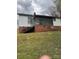 Exterior view of home with brick foundation, porch and stairs at 1010 13Th St # 11, Lancaster, SC 29720