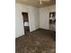 A quaint living room with wood-paneled walls and ceiling fan awaiting renovation at 1010 13Th St # 11, Lancaster, SC 29720