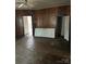 Living room with wood paneling, wood floor, ceiling fan and exterior access door at 1010 13Th St # 11, Lancaster, SC 29720