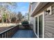 Back deck area with wooden railing and siding on a sunny day at 1052 Palmyra Dr, Fort Mill, SC 29708