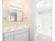 Bright bathroom featuring white cabinets, a large mirror, and a shower/tub combo at 1052 Palmyra Dr, Fort Mill, SC 29708