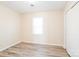 Bright bedroom with wood-look flooring and a sunny window at 1052 Palmyra Dr, Fort Mill, SC 29708