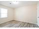 Bright bedroom with light walls and wood-look flooring at 1052 Palmyra Dr, Fort Mill, SC 29708