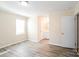 Inviting bedroom with laminate floors, neutral walls, a window and en-suite bathroom at 1052 Palmyra Dr, Fort Mill, SC 29708