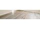 Bright bedroom features light-colored laminate floors, neutral walls, and a window providing natural light at 1052 Palmyra Dr, Fort Mill, SC 29708