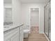 Bright bathroom featuring granite countertop vanity and glass-enclosed shower at 107 Adams Tree Way, Troutman, NC 28166