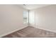 Cozy bedroom with carpet flooring and a window for natural light at 107 Adams Tree Way, Troutman, NC 28166