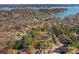 A view of a property line bordering a lake community surrounded by mature trees at 109 Gannett Dr, Mooresville, NC 28117