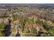 Aerial view of a property with defined boundaries, nestled among mature trees and lush greenery at 109 Gannett Dr, Mooresville, NC 28117