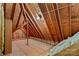 Unfinished attic with wooden beams and ample space for storage at 109 Gannett Dr, Mooresville, NC 28117