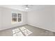 Bedroom featuring a ceiling fan and a large window at 109 Gannett Dr, Mooresville, NC 28117