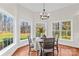 Cozy dining area featuring large bay windows with views of the backyard and natural light at 109 Gannett Dr, Mooresville, NC 28117