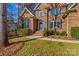 Close up of a brick home with stairs to a front door flanked by manicured landscaping at 109 Gannett Dr, Mooresville, NC 28117