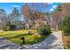 Beautiful two-story brick home with a long driveway and a spacious front yard at 109 Gannett Dr, Mooresville, NC 28117
