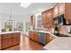 Spacious kitchen with wood cabinetry, stainless steel appliances, and a sunny breakfast nook at 109 Gannett Dr, Mooresville, NC 28117