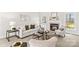 Cozy living room showcasing a fireplace, neutral decor, and comfortable seating at 109 Gannett Dr, Mooresville, NC 28117