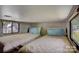 Comfortable RV bedroom setup with two twin beds, window, and overhead storage at 109 Pembrooke Trl # F171, Mount Gilead, NC 27306