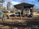 RV is parked under a covered area with a playground in the yard at 109 Pembrooke Trl # F171, Mount Gilead, NC 27306
