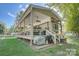 Charming exterior view with covered porch and deck, enhancing the home's appeal for outdoor enjoyment and relaxation at 109 Pembrooke Trl # F171, Mount Gilead, NC 27306